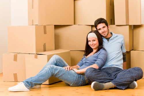 Professional movers carrying items during a Westwickham small removal